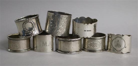 Eight assorted silver napkin rings, including one pair.